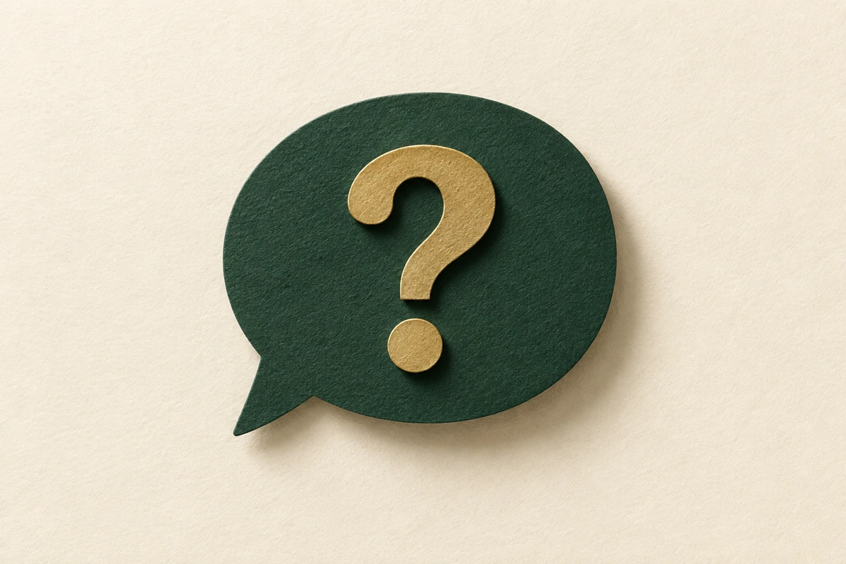 Paper-cut speech bubble with a question mark, illustrating questions to ask an insurer or agent.